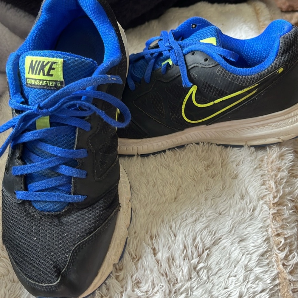 Unisex Nike athletic shoes, size 8.  Black with royal blue & lime green trim!